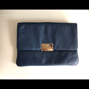 Michael Kors envelope clutch and crossbody purse.